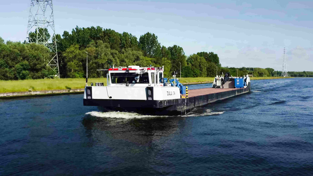 The test vessel, Zulu 4, an inland waterway barge owned by Blue Line Logistics NV, is equipped for remote-operated and autonomous transport demonstrations for the AUTOSHIP project, which is part of Horizon 2020, an EU research programme.