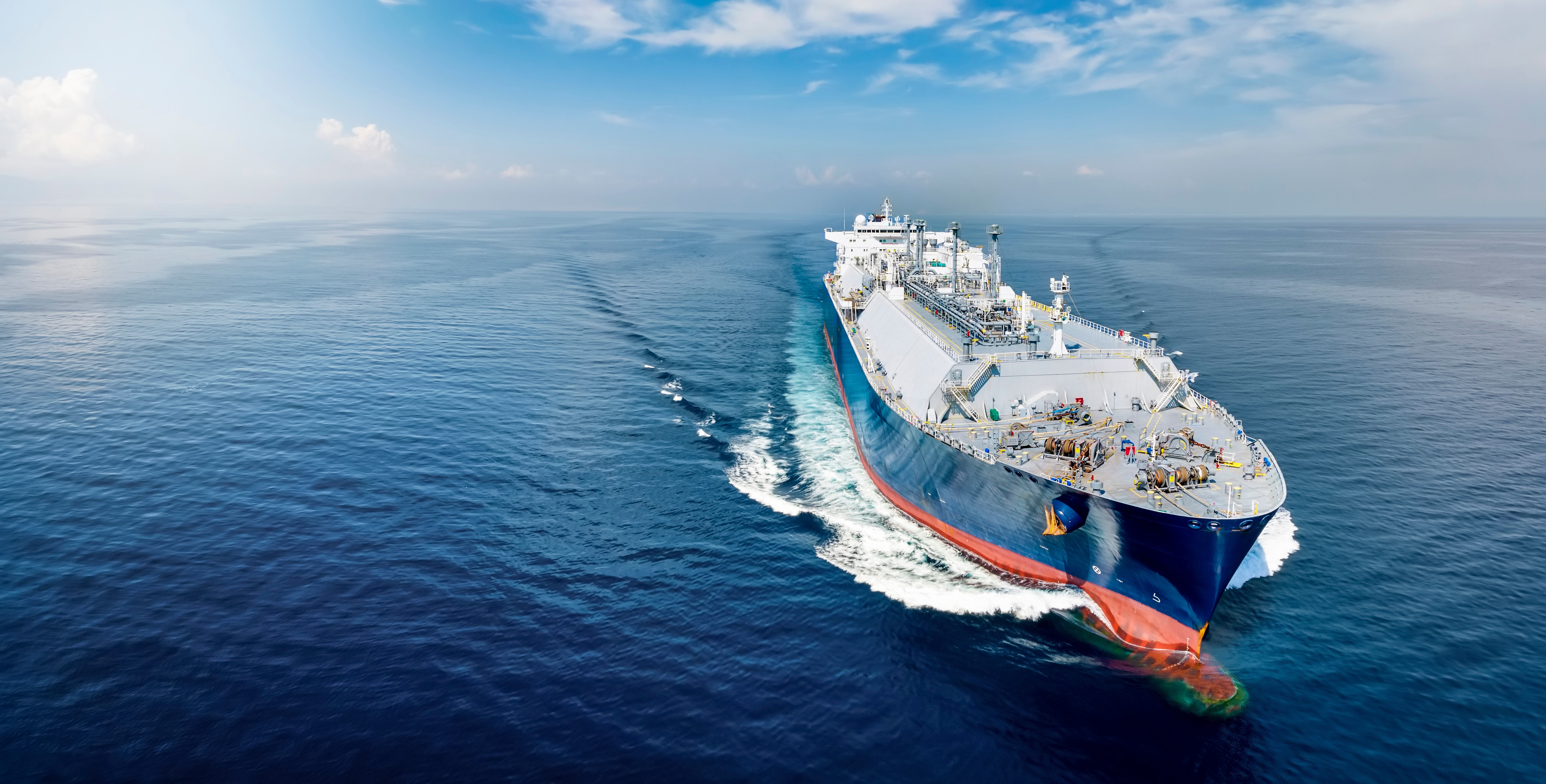 An image of a large, modern LNG carrier vessel sailing in calm seas