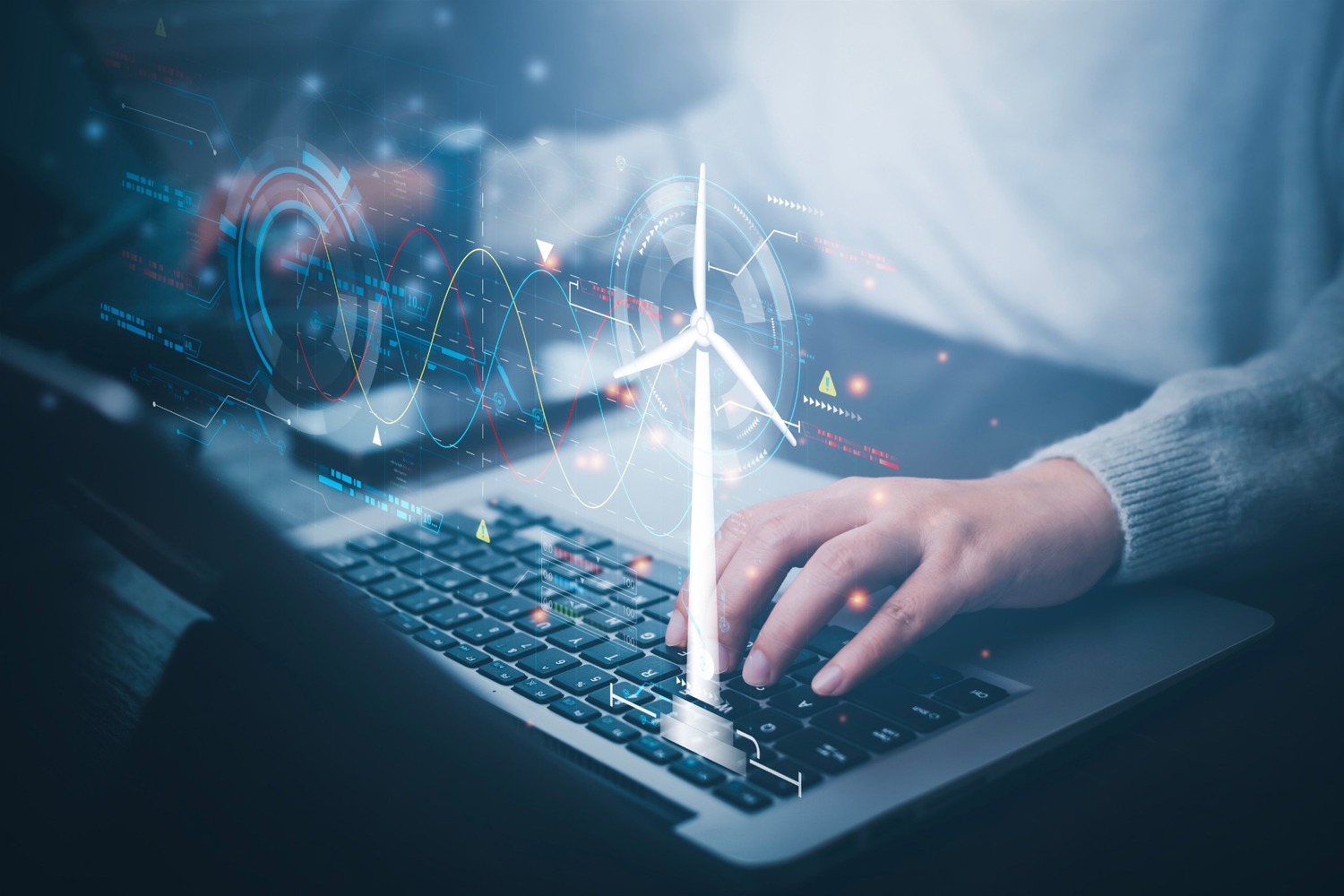 Hands typing on a keyboard with an analytics interface overlay and a wind turbine icon