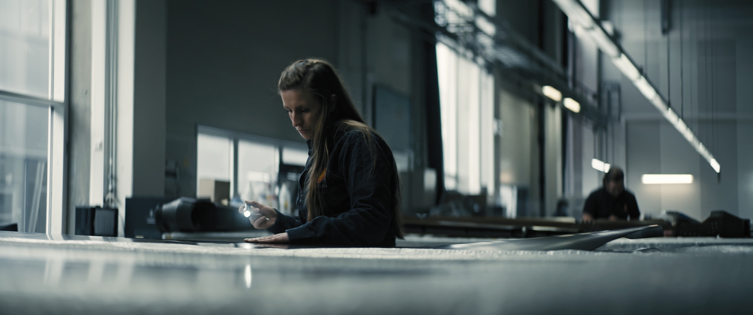 Woman inspecting composites