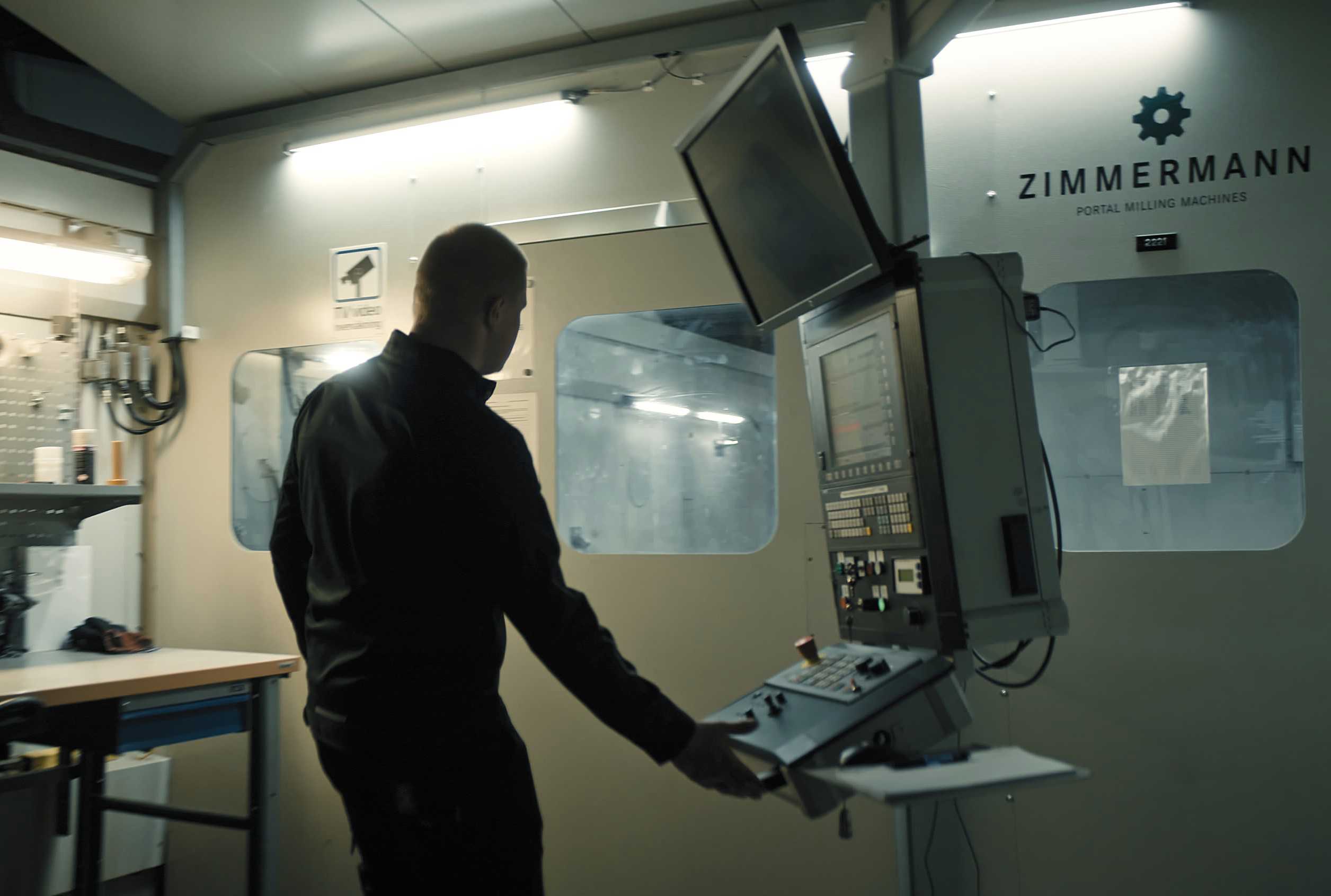 KONGSBERG employee working with measuring machine