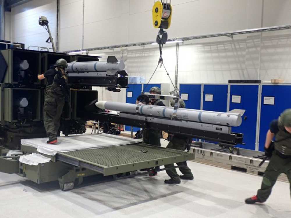 Norwegian Technical Support Staff loading AMRAAM missiles into the Australian Army’s NASAMS Mk 2 Canister Launcher as part of Factory Acceptance Testing in Kongsberg, Norway. Credit: KONGSBERG