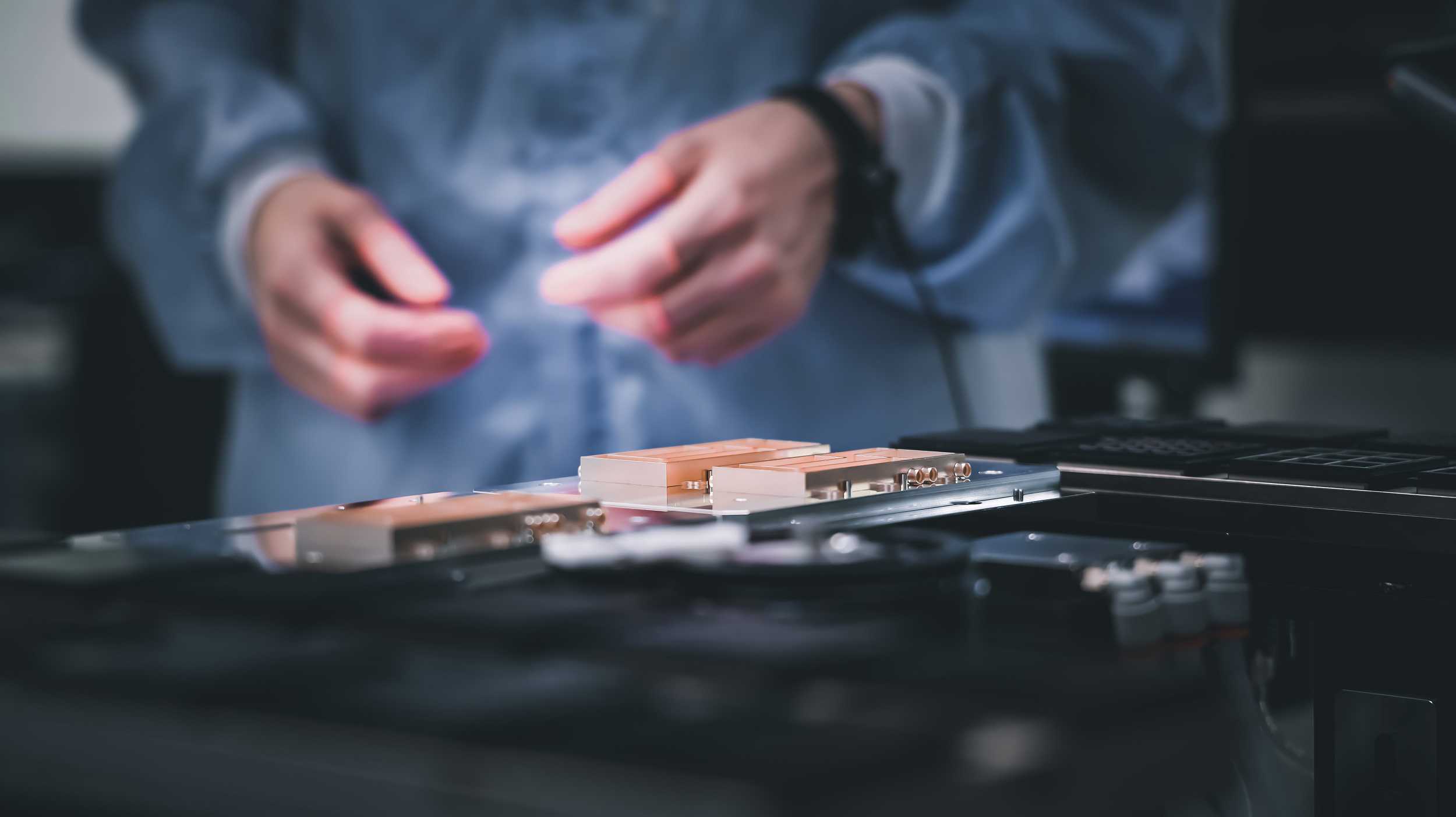 A scientist's hands and a space electronic product