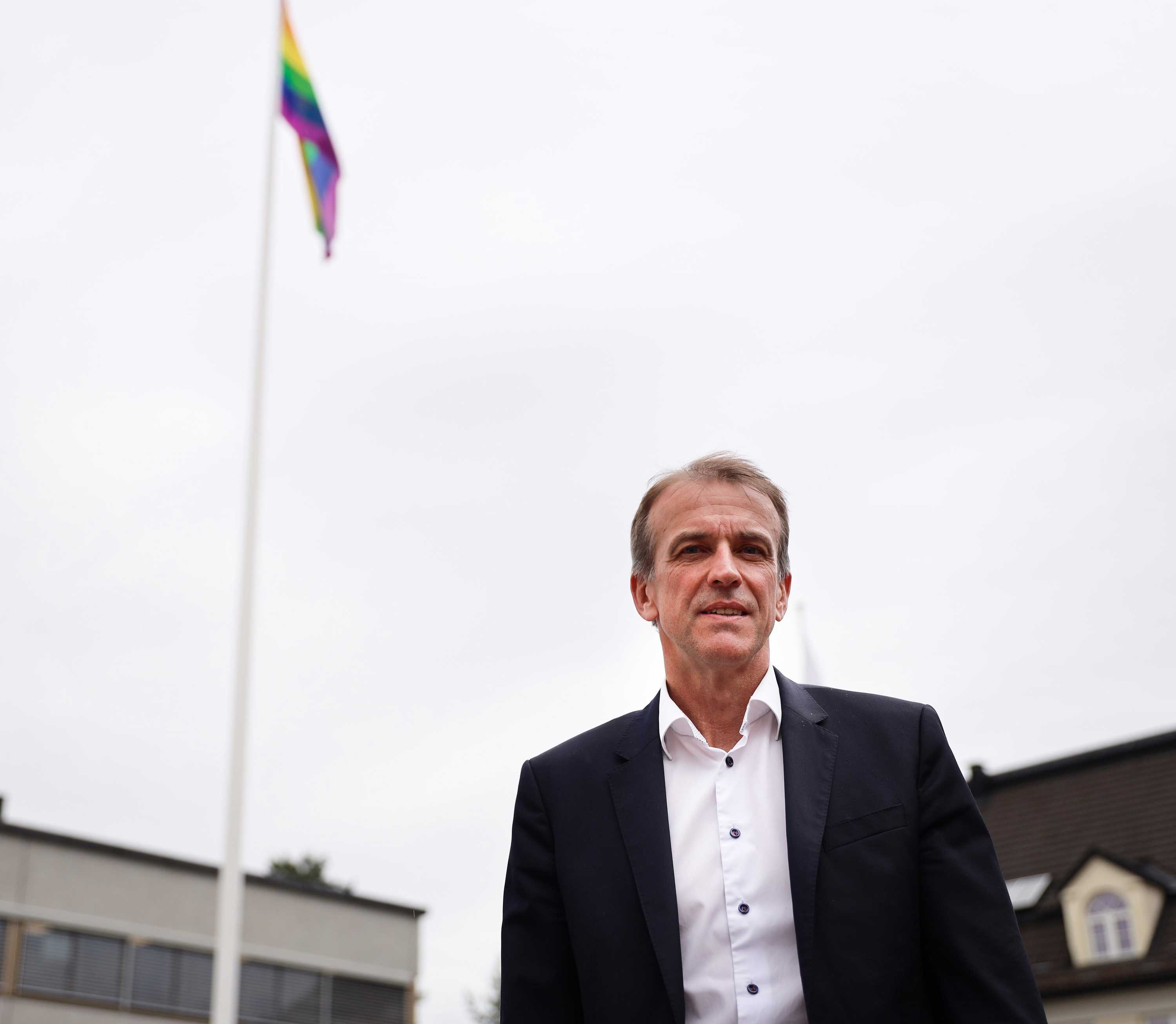 President of Kongsberg Defence & Aerospace, Eirik Lie, infront of the company's pride flag