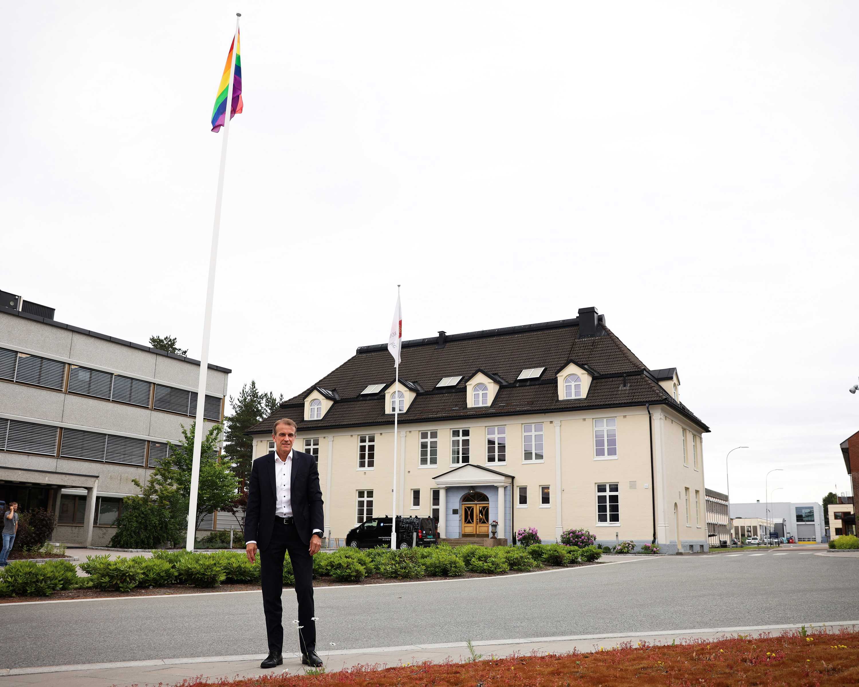 Eirik Lie, from Kongsberg Defence & Aerospace, infront of Pride flag at KONGSBERG HQ