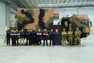 Kongsberg Defence Australia’s NASAMS Production Team with soldiers from 16 Regiment, Royal Australian Artillery, during a recent fitment check of the Fire Distribution Centre on the HX-40M vehicle.