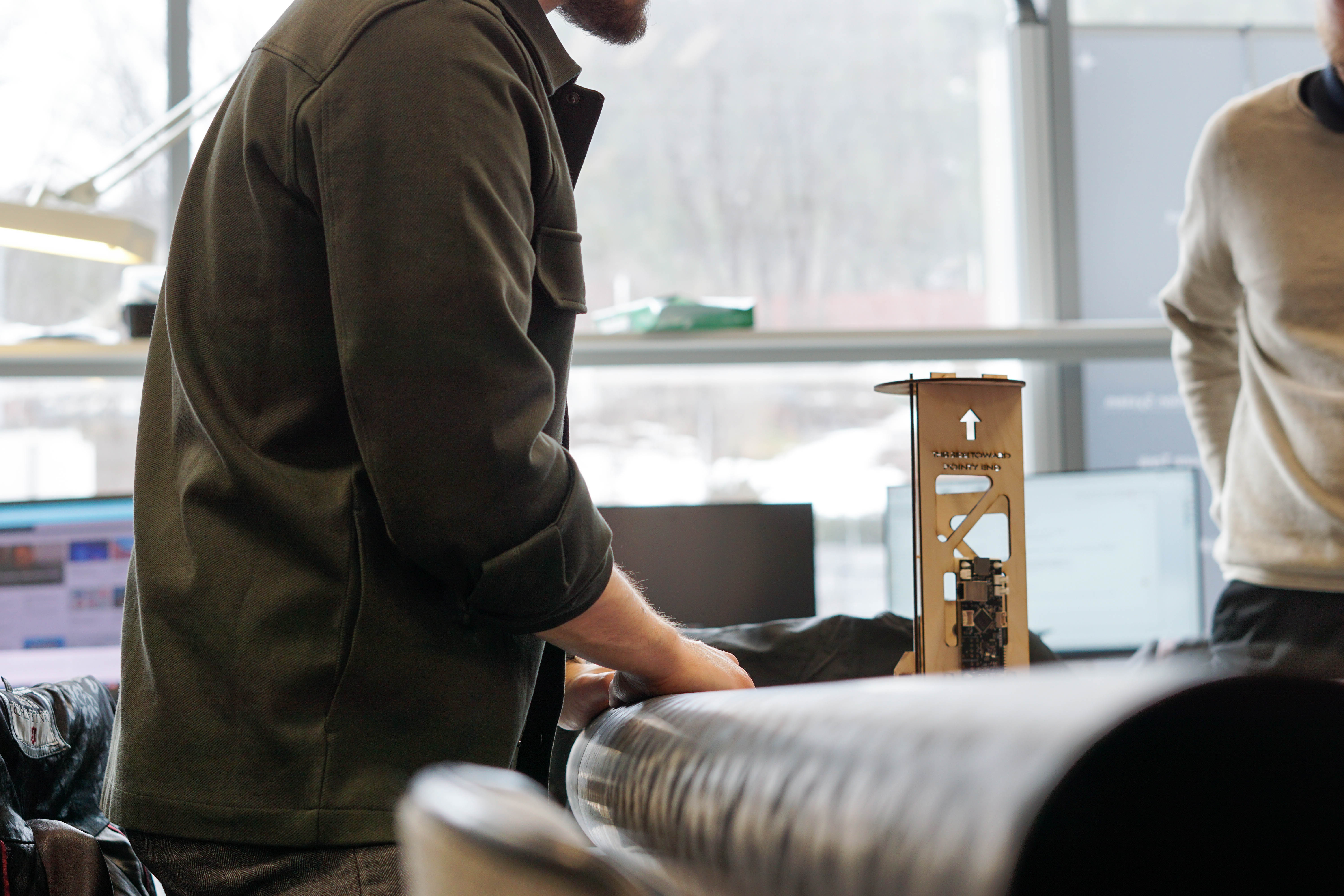 Image of man working with rocket components