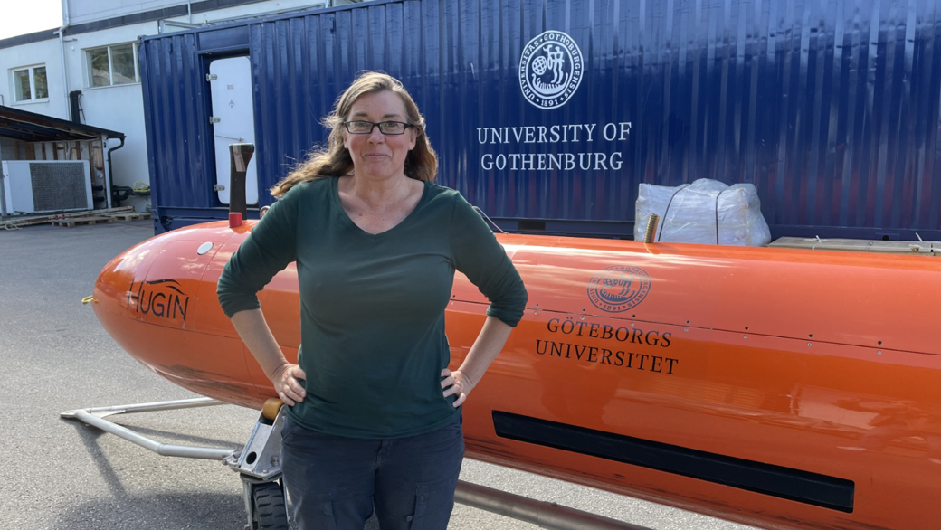 Anna Wåhlin in front of a HUGIN AUV