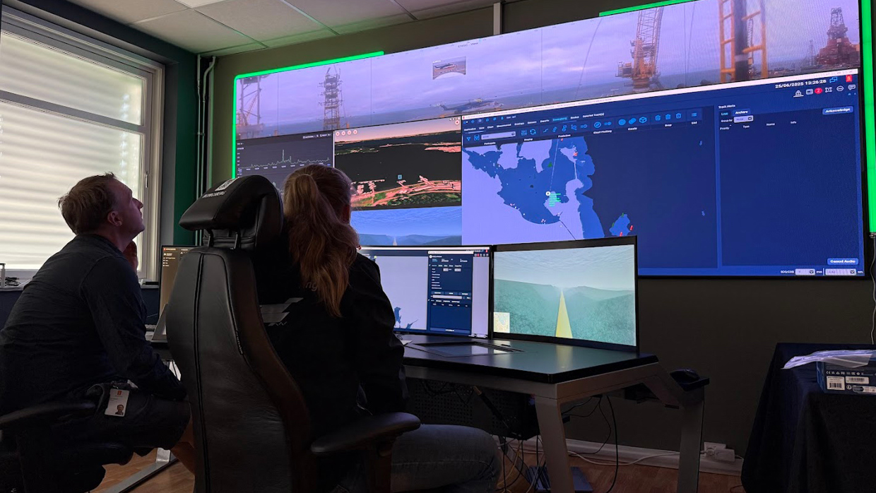 Operating room with two people watching multiple monitors