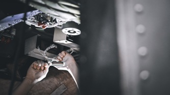 KAMS employee working inside a chopper