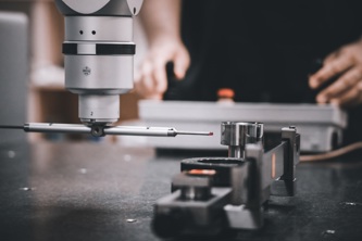 KAMS employee working on new chopper part