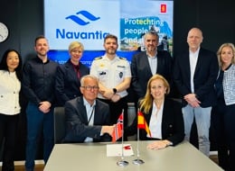 Representatives from KONGSBERG and Navantia signing an agreement and shaking hands