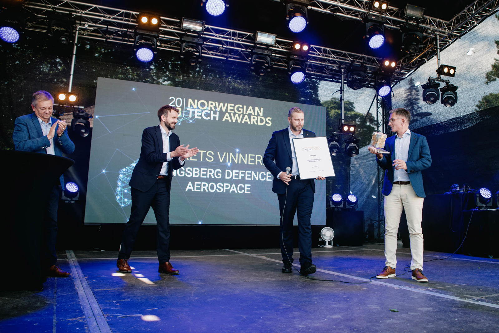 Image of men on stage