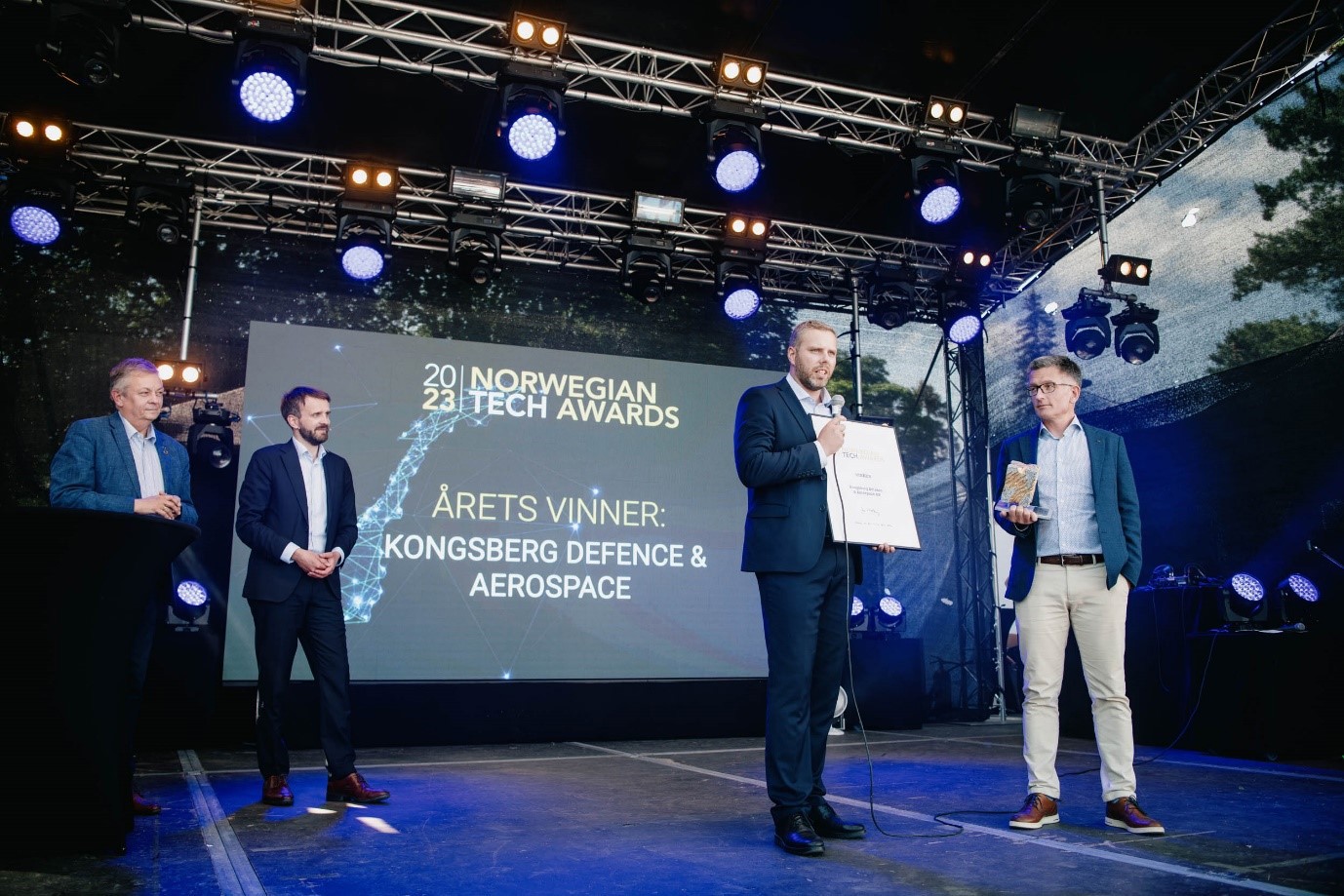 Image of men on stage