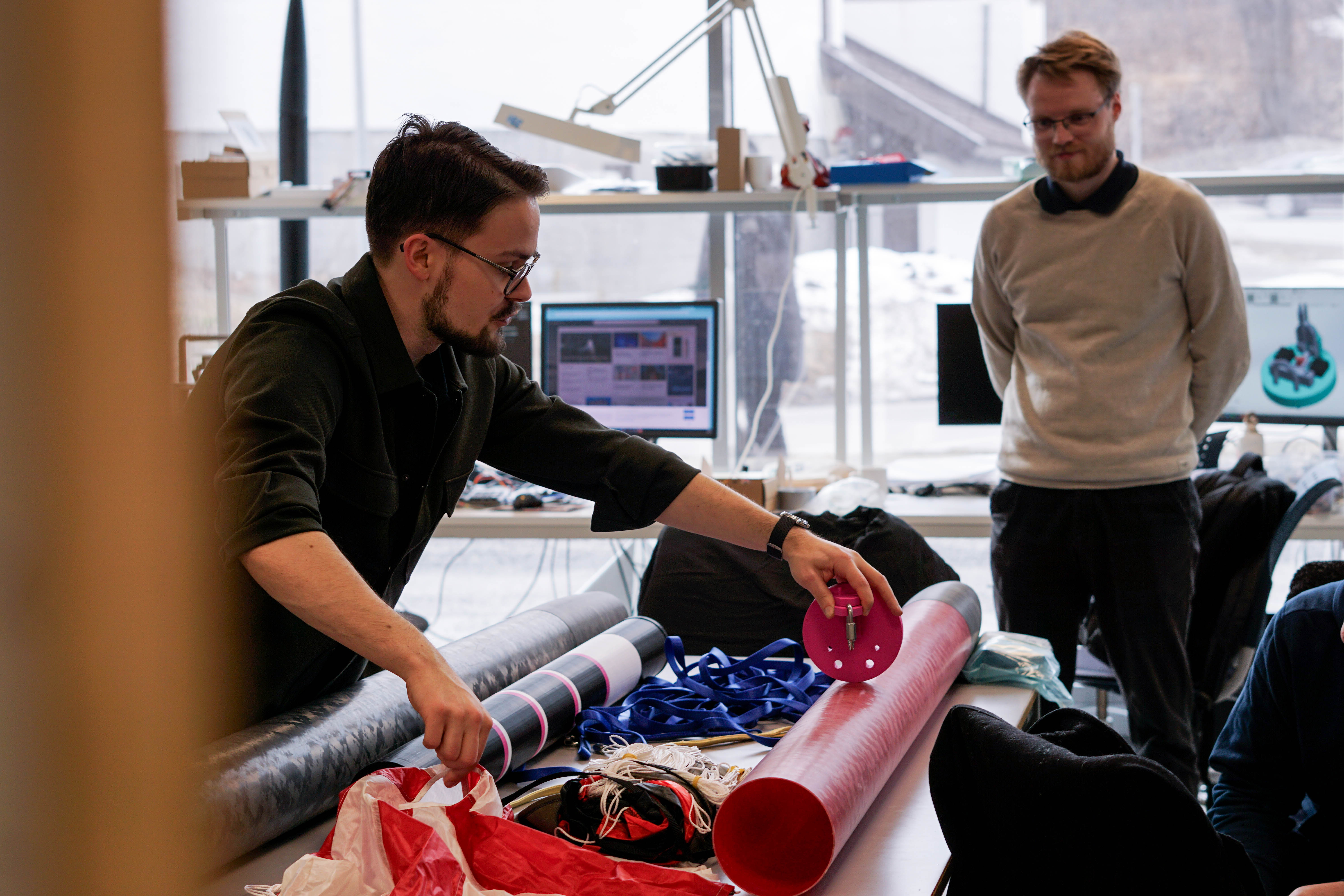 Image of a man working with rocket components
