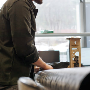 Image of man working with rocket components